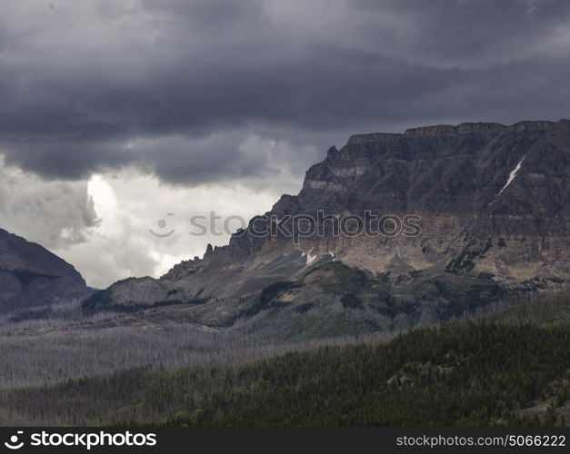 Scenic view of mountain range against cloudy sky, Going-to-the-Sun Road, Glacier National Park, Glacier County, Montana, USA