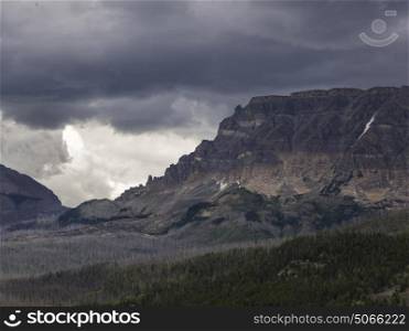 Scenic view of mountain range against cloudy sky, Going-to-the-Sun Road, Glacier National Park, Glacier County, Montana, USA