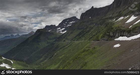 Scenic view of mountain range against cloudy sky, Going-to-the-Sun Road, Glacier National Park, Glacier County, Montana, USA
