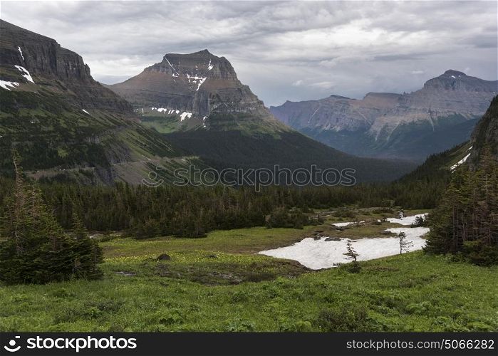 Scenic view of mountain range against cloudy sky, Logan Pass, Glacier National Park, Glacier County, Montana, USA