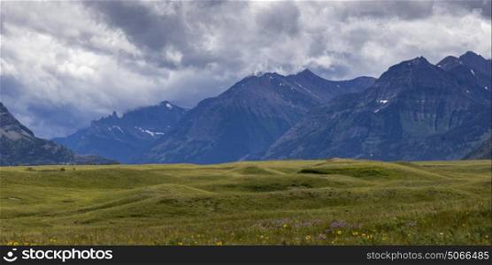 Scenic view of mountains against cloudy sky, Waterton Lakes National Park, Southern Alberta, Alberta, Canada