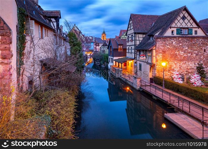 Scenic view of old medieval houses on the canal at sunset. Colmar. Alsace France.. Colmar. France. Old houses on the canal.