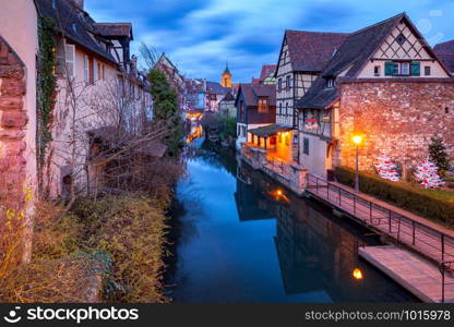 Scenic view of old medieval houses on the canal at sunset. Colmar. Alsace France.. Colmar. France. Old houses on the canal.