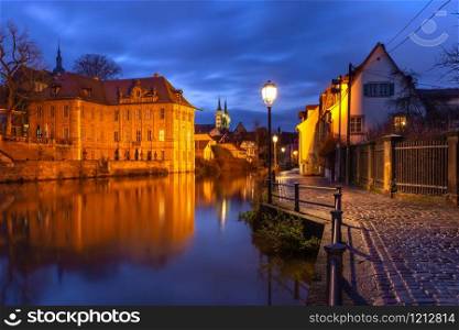 Scenic view of Old town over the Regnitz river at night in Bamberg, Bavaria, Upper Franconia, Germany. Old Town of Bamberg, Bavaria, Germany
