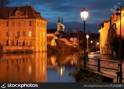 Scenic view of Old town over the Regnitz river at night in Bamberg, Bavaria, Upper Franconia, Germany. Old Town of Bamberg, Bavaria, Germany