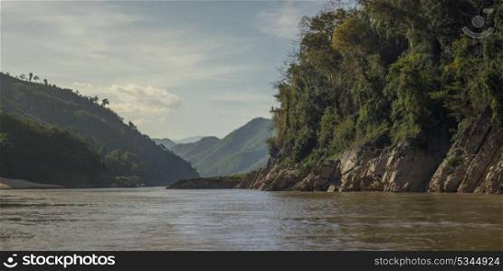 Scenic view of river with mountain range in background, River Mekong, Sainyabuli Province, Laos
