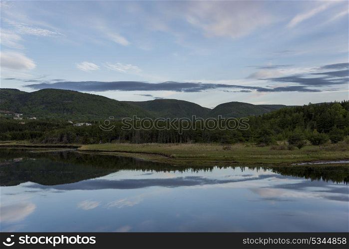 Scenic view of river with mountains in background, Margaree River, Cabot Trail, Cape Breton Island, Nova Scotia, Canada