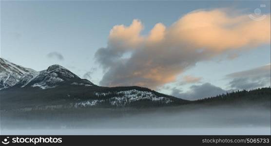 Scenic view of snowcapped mountain range, Pyramid Lake, Highway 16, Jasper, Jasper National Park, Alberta, Canada