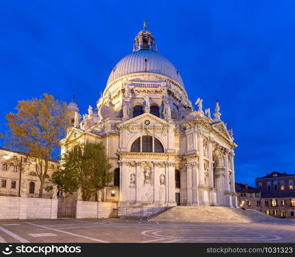 Scenic view of the Cathedral Santa Maria della Salute in night illumination.. Venice. Church of Santa Maria della Salute at sunset.