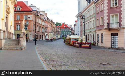 Scenic view of the old street in the center of the old city at dawn. Warsaw. Poland.. Warsaw. Old street in the center of the old city in the early morning.