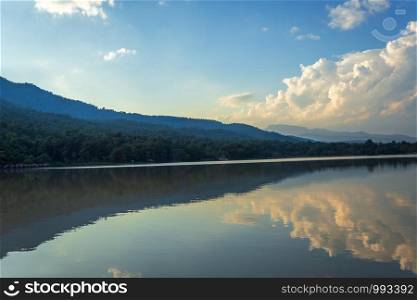 Scenic view of the reservoir Huay Tueng Tao with Mountain range forest at evening sunset in Chiang Mai, Thailand