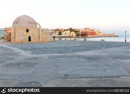 Scenic view Venetian embankment in Chania with the Mosque of Hassan Kuchuk Pasha early in the morning. Crete, Greece.