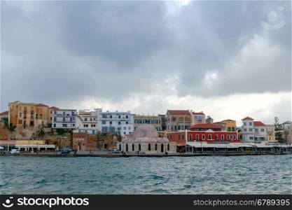 Scenic view Venetian embankment in Chania with the Mosque of Hassan Kuchuk Pasha. Crete, Greece.