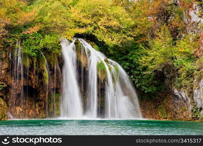 Scenic waterfall in a picturesque autumn scenery of the Plitvice Lakes National Park in Croatia