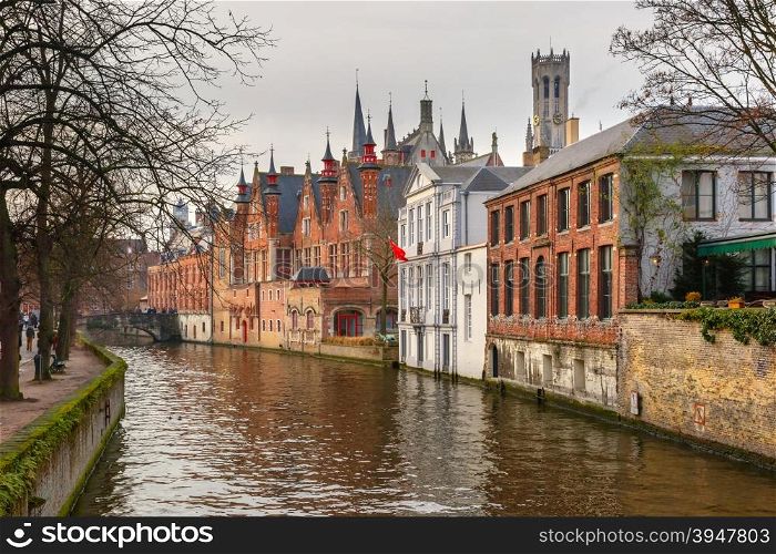 Scenic winter cityscape with a medieval tower Belfort and the Green canal, Groenerei, in Bruges, Belgium