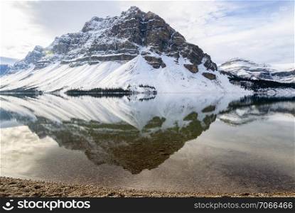 Scenic winter view of Bow Lake with Rocky mountain reflection in Banff National Park, Alberta, canada