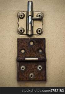 Schieberiegel. rusty hinge and sliding lock on a door