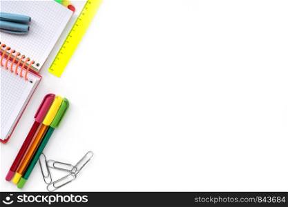 School and Office drawing supplies isolated on white background. Free space for text. Back to school. Top view border of colour pens, ruler and note. Back to school. School and Office drawing supplies isolated on white background. Free space for text.