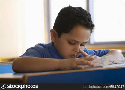 School boy at his desk