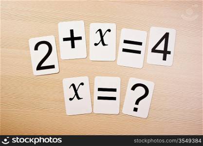 School card with math problems on the table
