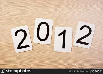 School card with new year 2012 on the table