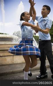 School children dancing salsa in center plaza