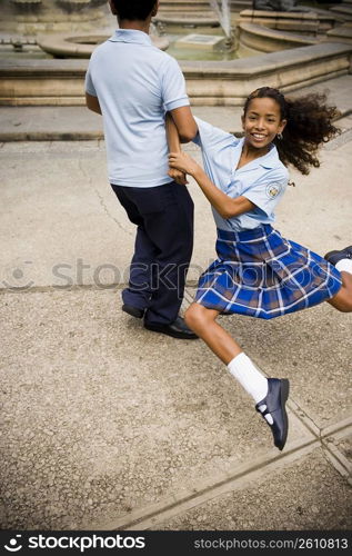 School children dancing salsa in center plaza