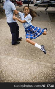 School children dancing salsa in center plaza