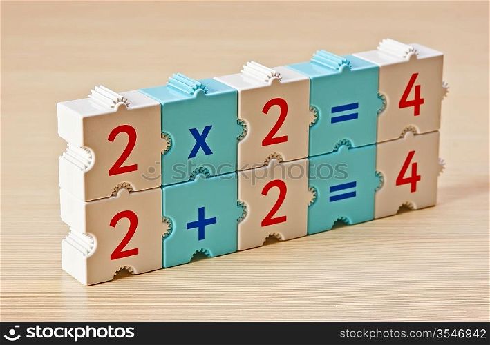 School cubes with math problems on the table