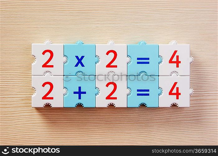 School cubes with math problems on the table