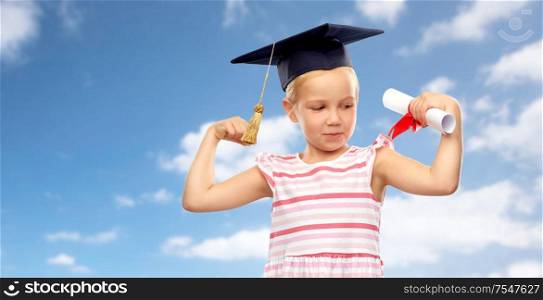 school, education and learning concept - happy little girl in bachelor hat or mortarboard with diploma over blue sky and clouds background. little girl in mortarboard with diploma