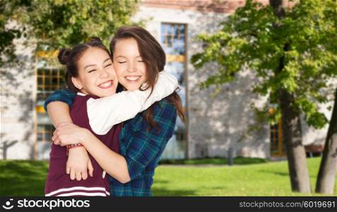 school, education, people, teens and friendship concept - happy smiling pretty teenage student girls hugging over summer campus background