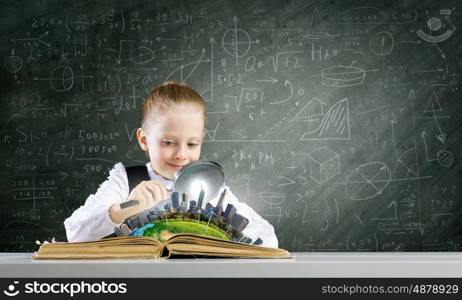 School education. Schoolgirl examining opened book with magnifying glass. Elements of this image are furnished by NASA