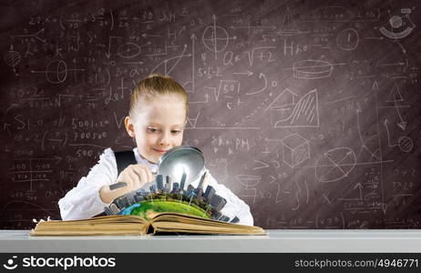 School education. Schoolgirl examining opened book with magnifying glass. Elements of this image are furnished by NASA