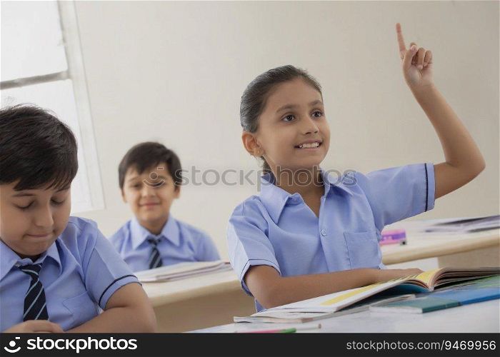 school girl asking for a doubt in class