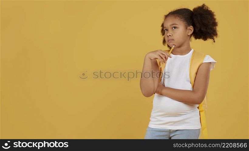 school girl copy space yellow background