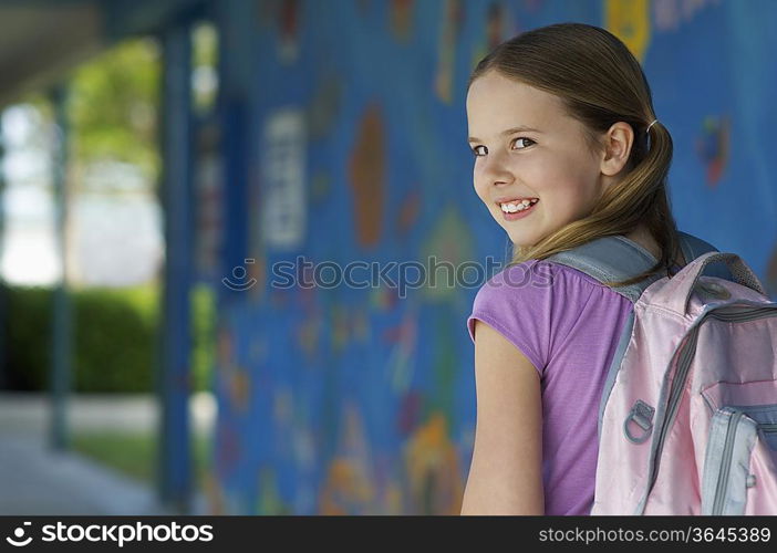 School girl outside school