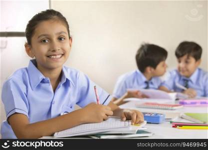 school girl sitting in class and smiling