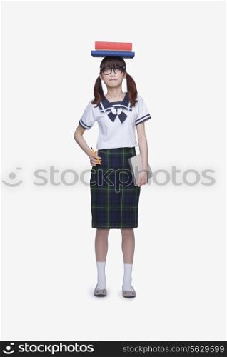School Girl with Books on Head