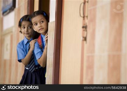 School girls peeping from a classroom