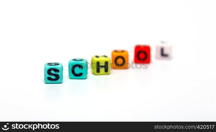 school - made from multicolored child toy cubes with letters