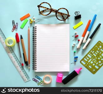 School notebook and various stationery. Back to school concept.