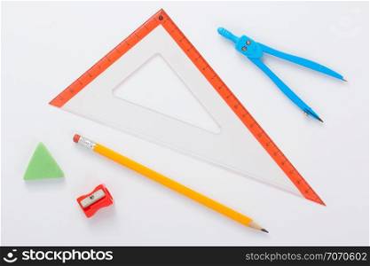 school set and ruler at white background, top view