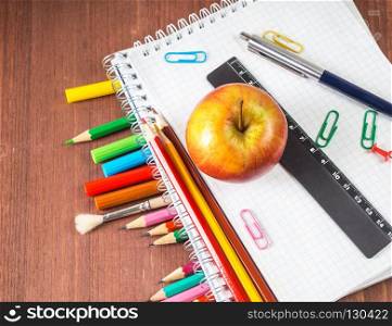 School supplies on a wooden background. Back to school