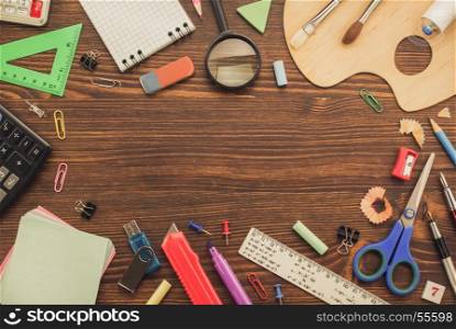 school supplies on wooden background