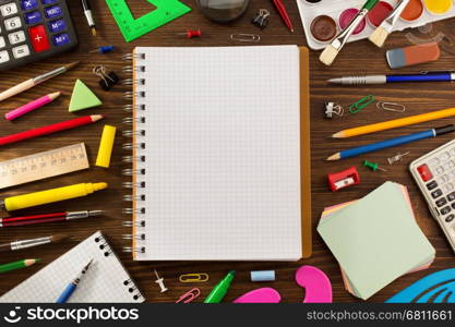 school supplies on wooden background