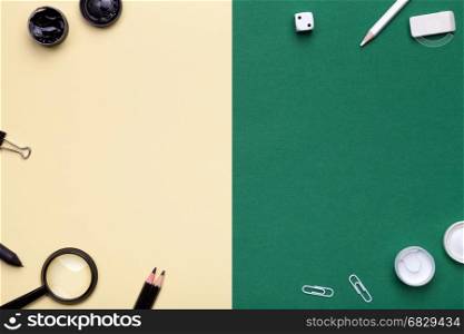 School Supplies on yellow and green background. Flat lay. Minimal style. Copy space. Top view