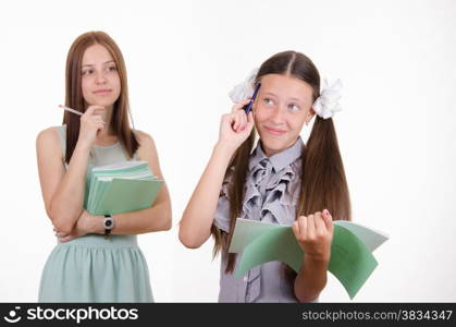 School teacher listens to the student who completed the homework