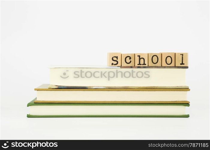 school word on wood stamps stack on books