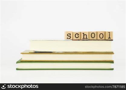 school word on wood stamps stack on books